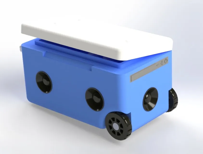 Render of a blue cooler with a white lid slightly open, on a light background. Black circular speaker units are set into the long side wall and the end wall. A grey strip on the end wall is marked with minus, plus, and power symbols. Black wheels are mounted at the bottom of that end.